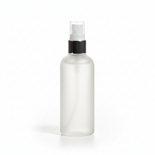 Clear spray bottle with black nozzle on a white background
